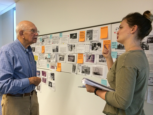 Harry O. Larson, one of the Gallaudet 11, reviews a draft exhibition script with CDDS intern Maggie Kopp. Credit: Brian H. Greenwald 